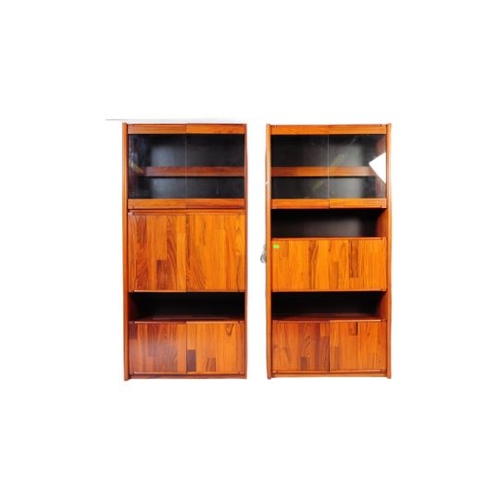 632 - A 20th century Belgium fruit wood wall unit comprising of a series of glazed and fall front cabinets... 