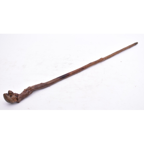 101 - A 19th century Boer War era carved blackthorn walking stick. The cane with carved knop top in the fo... 