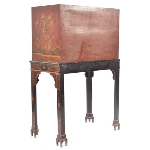 102 - A 19th century Chinoiserie cabinet on stand. The upper cupboard section having a single panelled doo... 