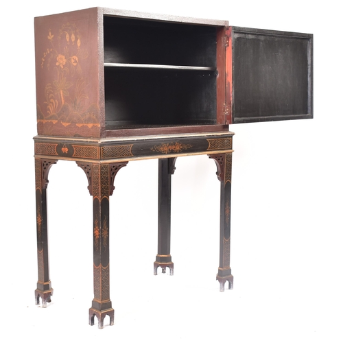 102 - A 19th century Chinoiserie cabinet on stand. The upper cupboard section having a single panelled doo... 