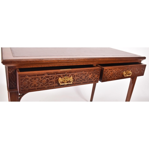 107 - A late 19th century Victorian mahogany Chinese Chippendale influenced writing table desk. The desk h... 