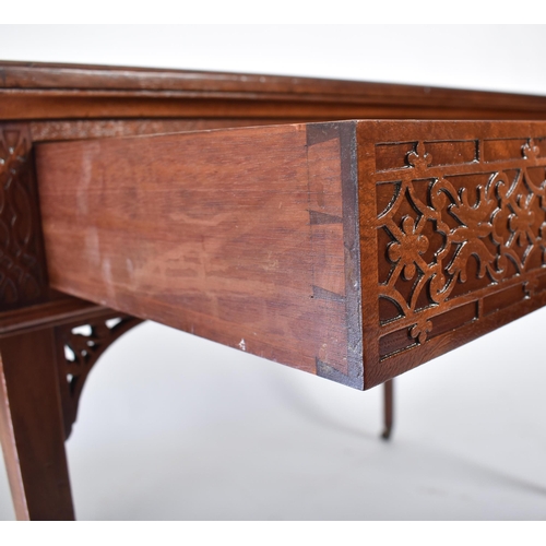 107 - A late 19th century Victorian mahogany Chinese Chippendale influenced writing table desk. The desk h... 