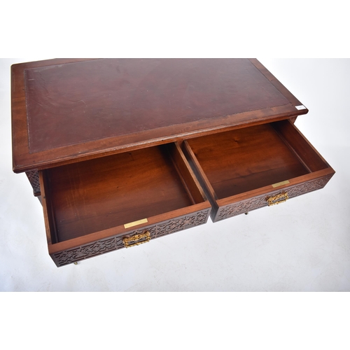 107 - A late 19th century Victorian mahogany Chinese Chippendale influenced writing table desk. The desk h... 