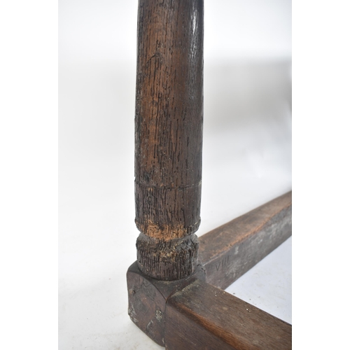 111 - A 17th century English oak refectory dining table. Raised on turned legs with low peripheral oak str... 