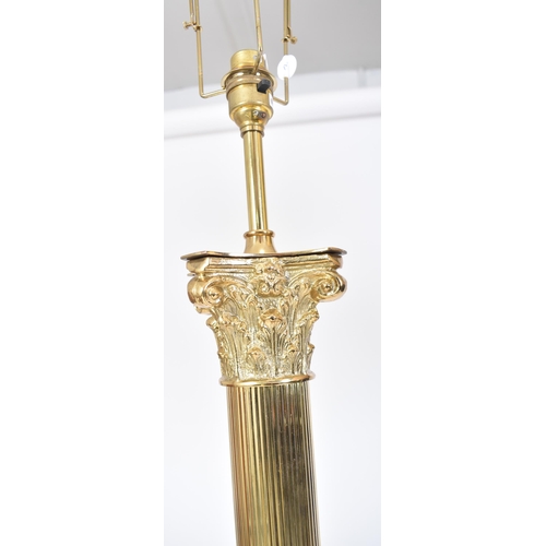 113 - A pair of 20th century gilt metal neoclassical inspired floor standard lamps lights. Each lamp in th... 