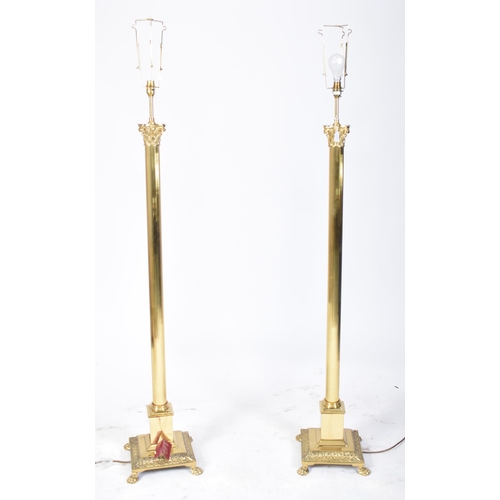 113 - A pair of 20th century gilt metal neoclassical inspired floor standard lamps lights. Each lamp in th... 