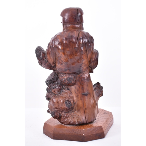 114 - A 20th century Chinese hand carved root wood deity of Prosperity figure. The sculpture modelled with... 