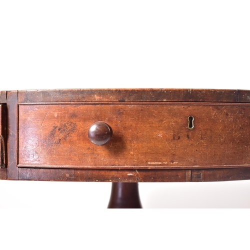 117 - A George III 19th century mahogany circular rent table. The table having a black leather skiver inse... 