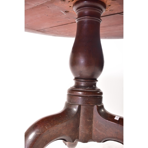 117 - A George III 19th century mahogany circular rent table. The table having a black leather skiver inse... 