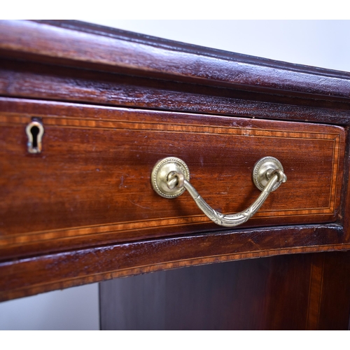 118 - An early 20th century Edwardian inlaid mahogany kidney shaped writing table desk. The desk having a ... 