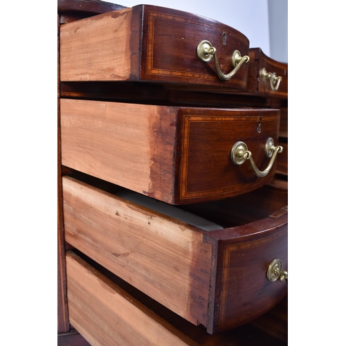 118 - An early 20th century Edwardian inlaid mahogany kidney shaped writing table desk. The desk having a ... 