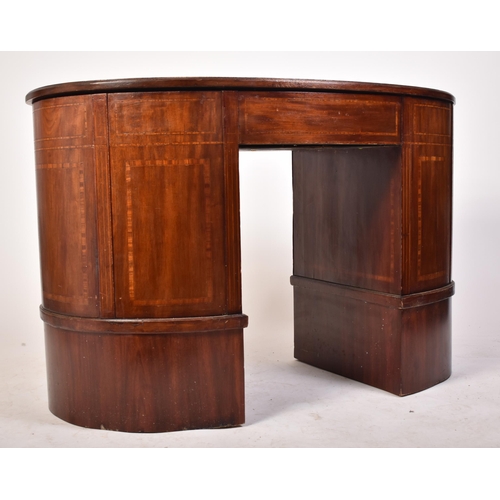 118 - An early 20th century Edwardian inlaid mahogany kidney shaped writing table desk. The desk having a ... 