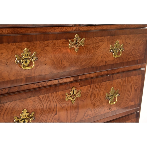 12 - An 18th century Queen Anne pollard oak crossbanded chest of drawers. Raised on bracket feet with sho... 