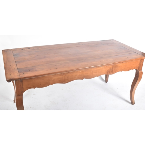 125 - A late 19th century French continental fruitwood refectory farmhouse dining table. The table having ... 