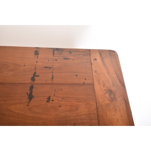 125 - A late 19th century French continental fruitwood refectory farmhouse dining table. The table having ... 