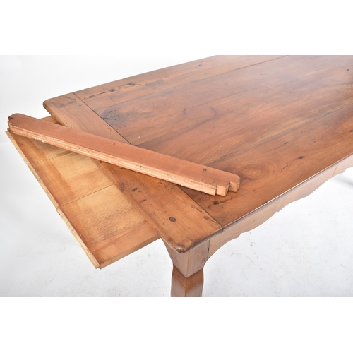 125 - A late 19th century French continental fruitwood refectory farmhouse dining table. The table having ... 