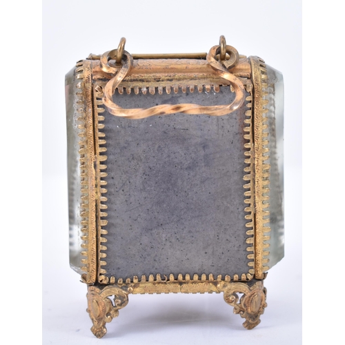 126 - A Victorian 19th century gilt metal & bevelled glass pocket watch casket case on feet. The casket wi... 