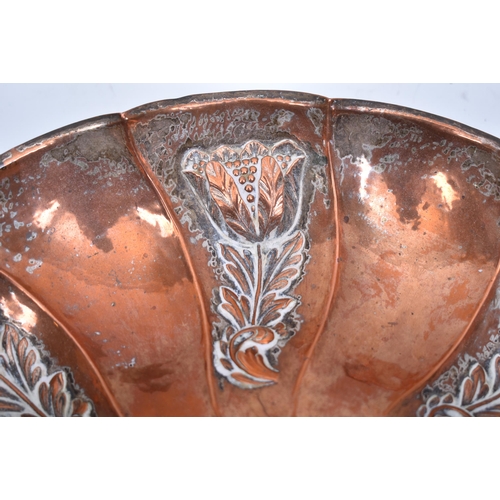 128 - An Arts & Crafts late 19th century Duchess of Sutherland Cripples Guild embossed copper centrepiece ... 