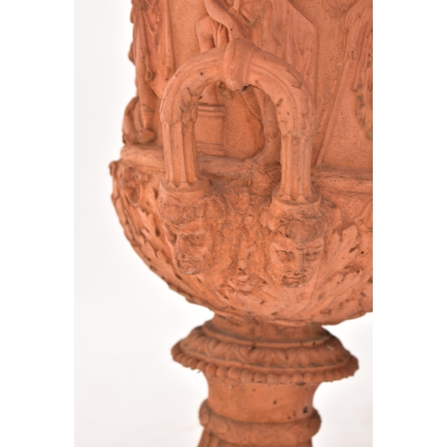 13 - A pair of 20th century circa 1930s Neo Classical style terracotta urn planters. Each having a gadroo... 