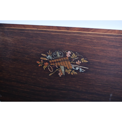 131 - A late 19th century continental Swiss made walnut veneered marquetry 8 airs music box. The box havin... 