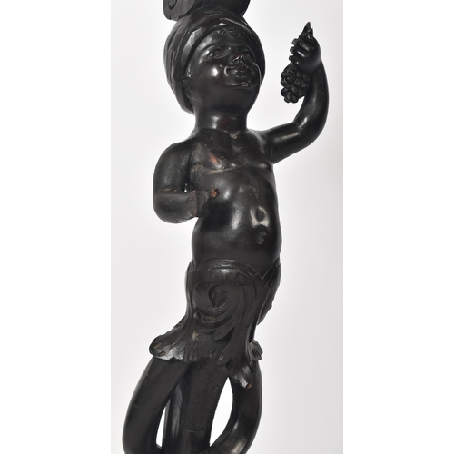 133 - A 19th century Italian blackamoor ebonised pine torchere bust / plant stand. Shaped top with carved ... 