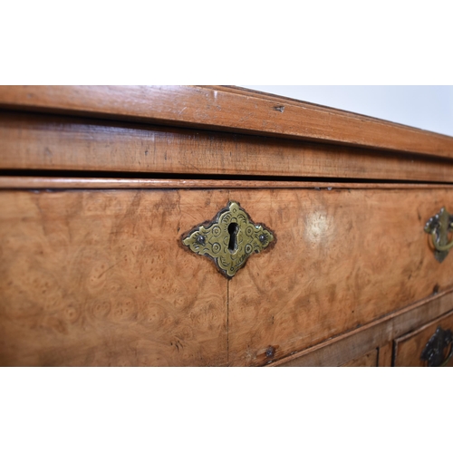 135 - A late 18th century Queen Anne revival walnut kneehole desk. Raised on bracket feet with drawers to ... 