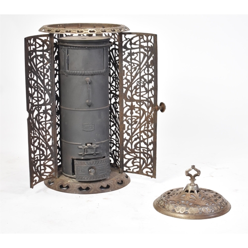 140 - A 19th century French continental black enamel cast iron conservatory / orangery wood burner. The wo... 