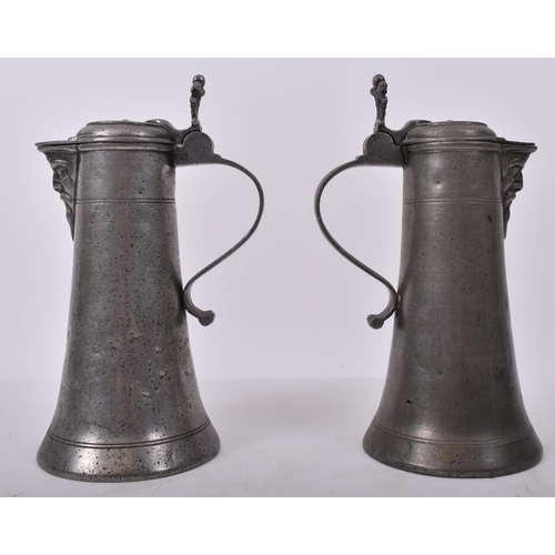 15 - A pair of early 18th century circa 1730 Swiss continental pewter Bartmannstize ' Bearded Man Flagon ... 