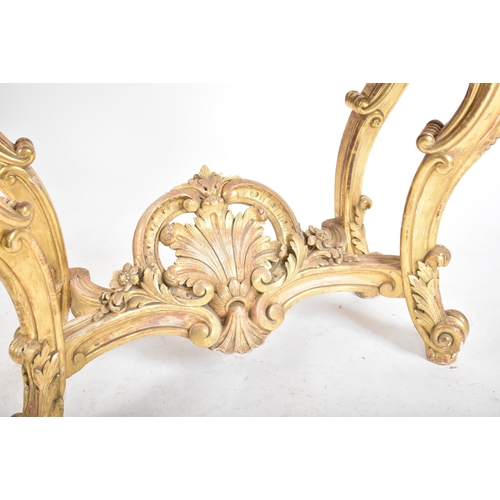 150 - A 19th century Rococo style gilt wood & marble top console hall table. The table having a serpentine... 