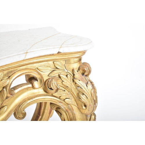 150 - A 19th century Rococo style gilt wood & marble top console hall table. The table having a serpentine... 