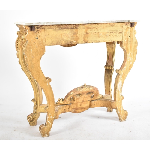 150 - A 19th century Rococo style gilt wood & marble top console hall table. The table having a serpentine... 