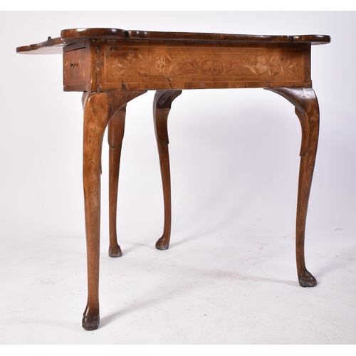 152 - An 18th century Dutch walnut & marquetry inlaid dog ear games / card table. Raised on cabriole legs ... 