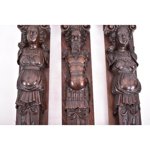 153 - A set of three 16th century French hand carved walnut termes. Each of upright form with carved scrol... 