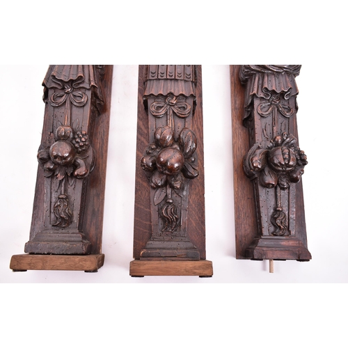 153 - A set of three 16th century French hand carved walnut termes. Each of upright form with carved scrol... 