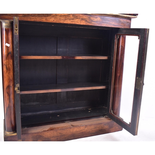 154 - A 19th century French Empire manner rosewood glazed bookcase cabinet. The cabinet having a straight ... 