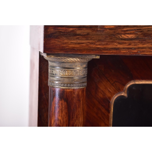 154 - A 19th century French Empire manner rosewood glazed bookcase cabinet. The cabinet having a straight ... 