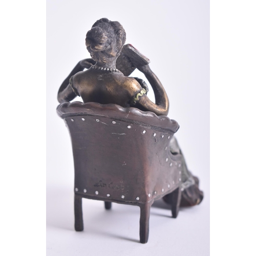 155 - Franz Bergman - an early 20th century Austrian cold painted bronze of a nude woman reading beneath a... 