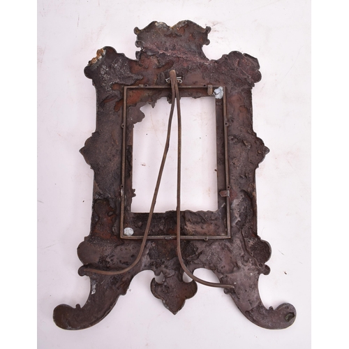 159 - An early 20th century Italian heavy copper standing photograph frame. The frame decorated with cheru... 