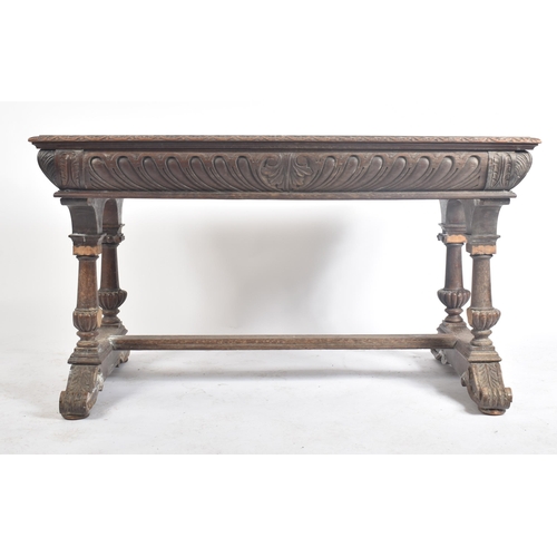 162 - A 19th century Victorian carved oak writing table desk. The oak top with gadrooned borders set over ... 