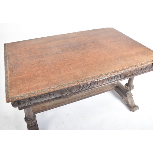 162 - A 19th century Victorian carved oak writing table desk. The oak top with gadrooned borders set over ... 