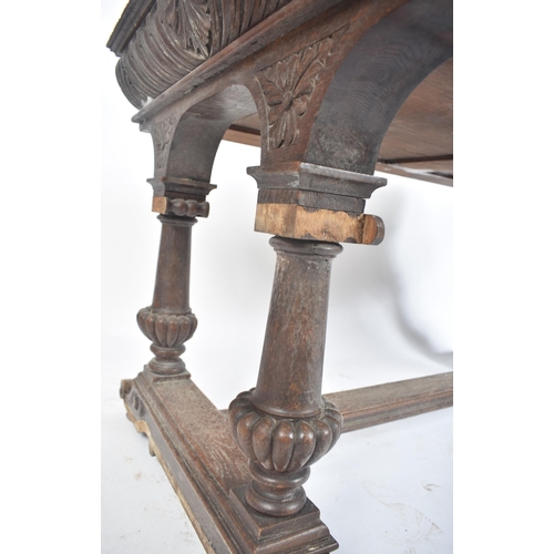 162 - A 19th century Victorian carved oak writing table desk. The oak top with gadrooned borders set over ... 