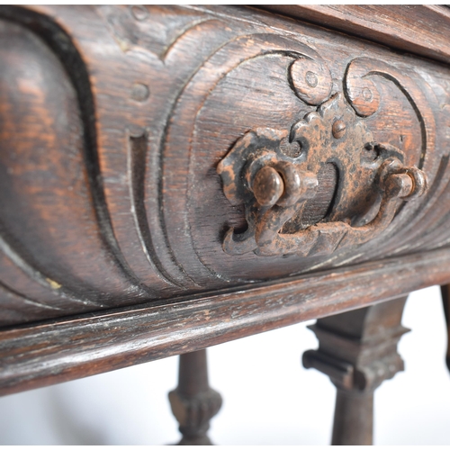 162 - A 19th century Victorian carved oak writing table desk. The oak top with gadrooned borders set over ... 