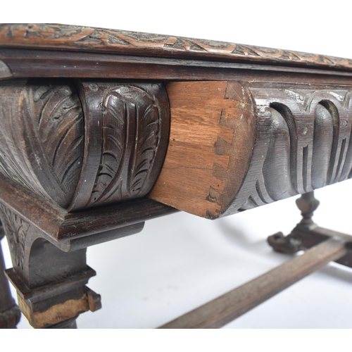 162 - A 19th century Victorian carved oak writing table desk. The oak top with gadrooned borders set over ... 