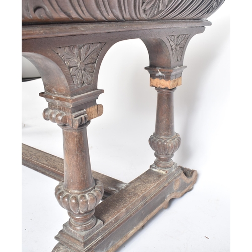 162 - A 19th century Victorian carved oak writing table desk. The oak top with gadrooned borders set over ... 