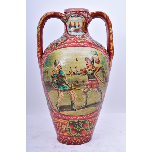 164 - An early 20th century Italian Sicilian painted terracotta twin handled amphora vase. The vase having... 