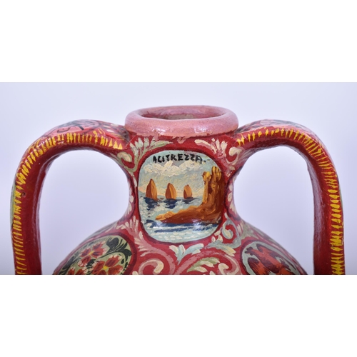 164 - An early 20th century Italian Sicilian painted terracotta twin handled amphora vase. The vase having... 