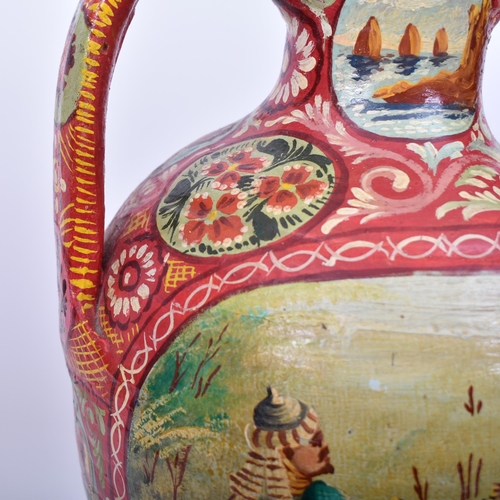 164 - An early 20th century Italian Sicilian painted terracotta twin handled amphora vase. The vase having... 