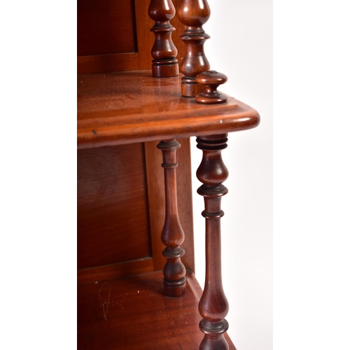 169 - A 19th century Victorian mahogany waterfall bookcase. The bookcase with twin turned column sides to ... 