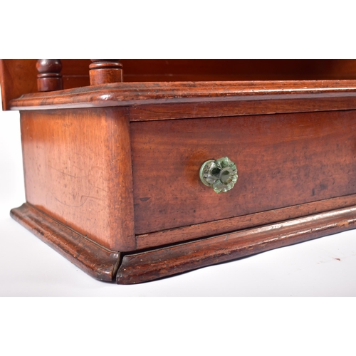 169 - A 19th century Victorian mahogany waterfall bookcase. The bookcase with twin turned column sides to ... 