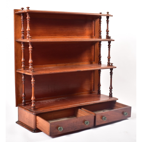 169 - A 19th century Victorian mahogany waterfall bookcase. The bookcase with twin turned column sides to ... 